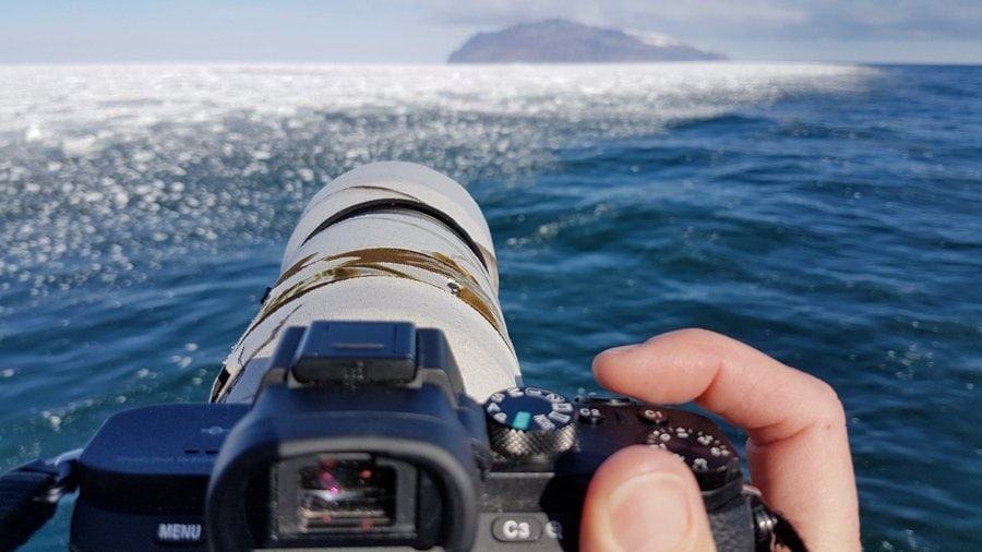 travel photography gear and tips - Lenscovers protecting my lens from Antarctic weather