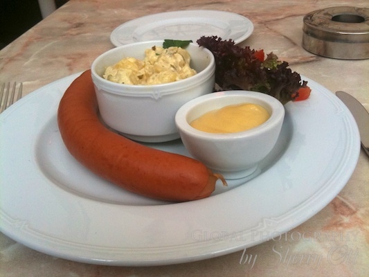 Sausage, potato salad, and mustard