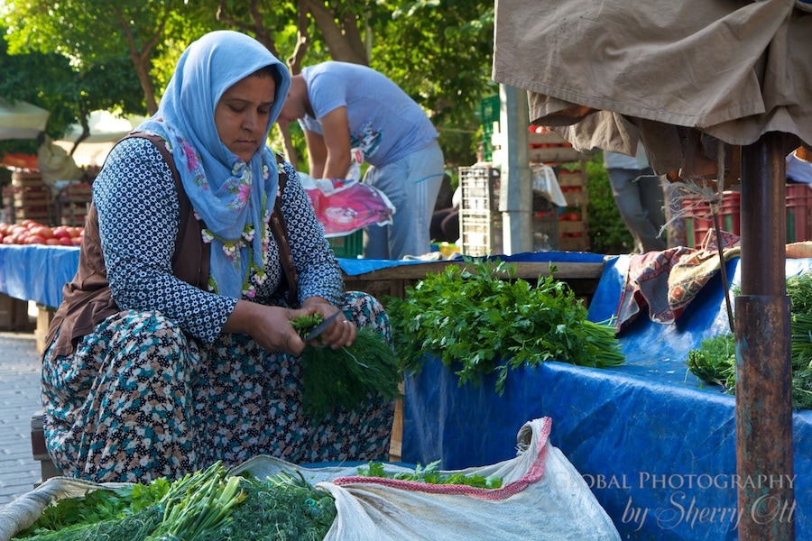 A woman prepares produce 