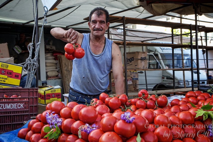 A man who is proud of his tomatoes