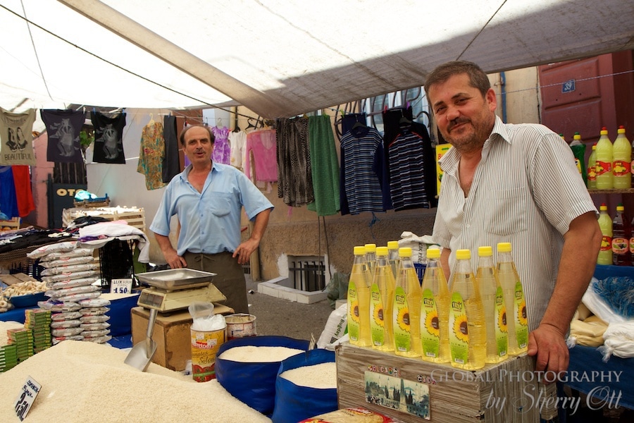 market vendors pose for pictures