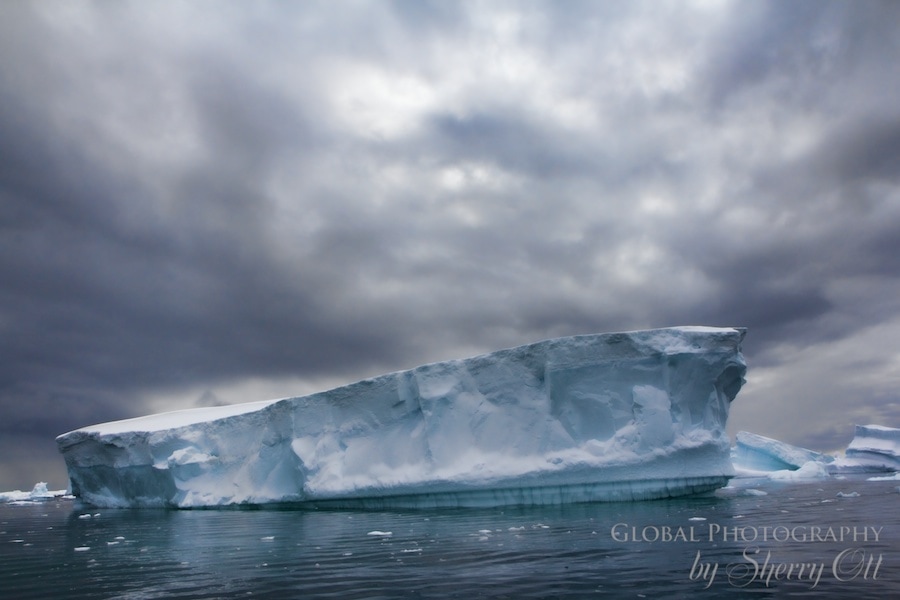 iceberg antarctica clouds landscape