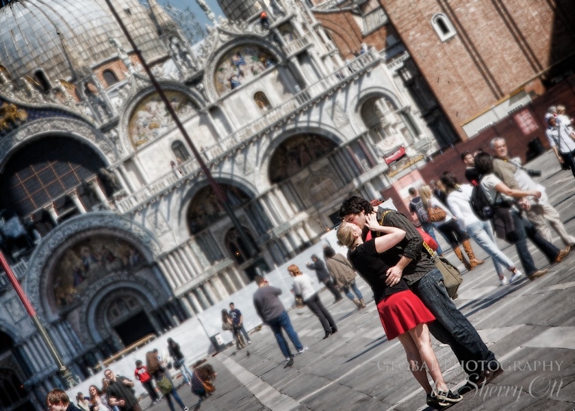 A couple kisses in St. Mark's square Venice