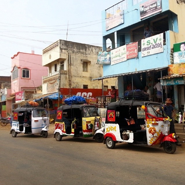 richshaw run convoy in the middle of India