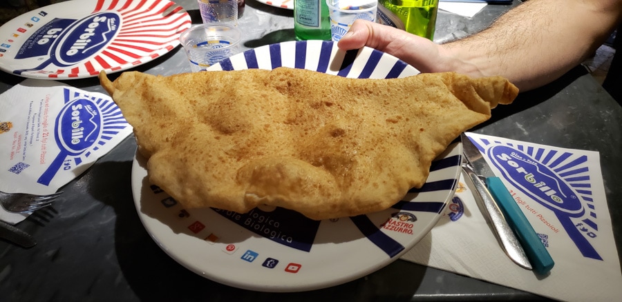 pizza fritta on a plate - one of the weightier Naples foods I tried!