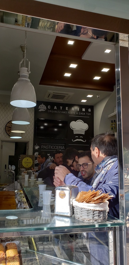 Italians sitting at the sideboard bar