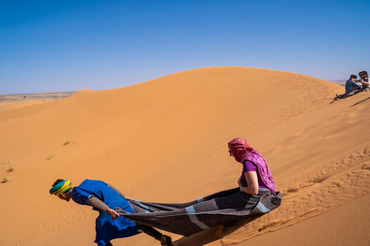 sand sledding morocco desert