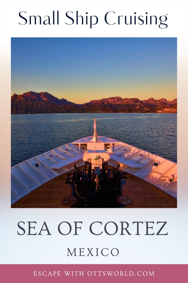Relaxing small ship cruise on the Sea of Cortez in Mexico, showcasing a scenic sunset view with mountains in the background, perfect for adventure and nature travel enthusiasts.