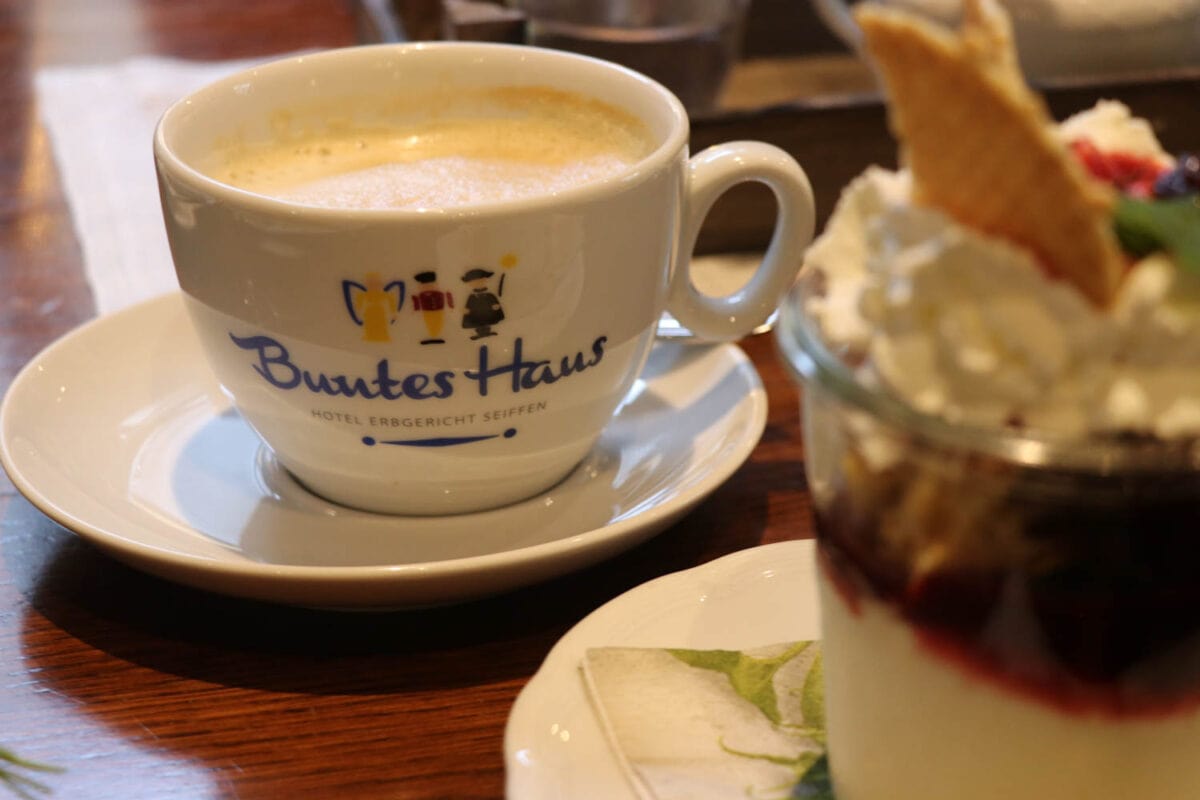 Closeup of coffee cup with words Buntes Haus