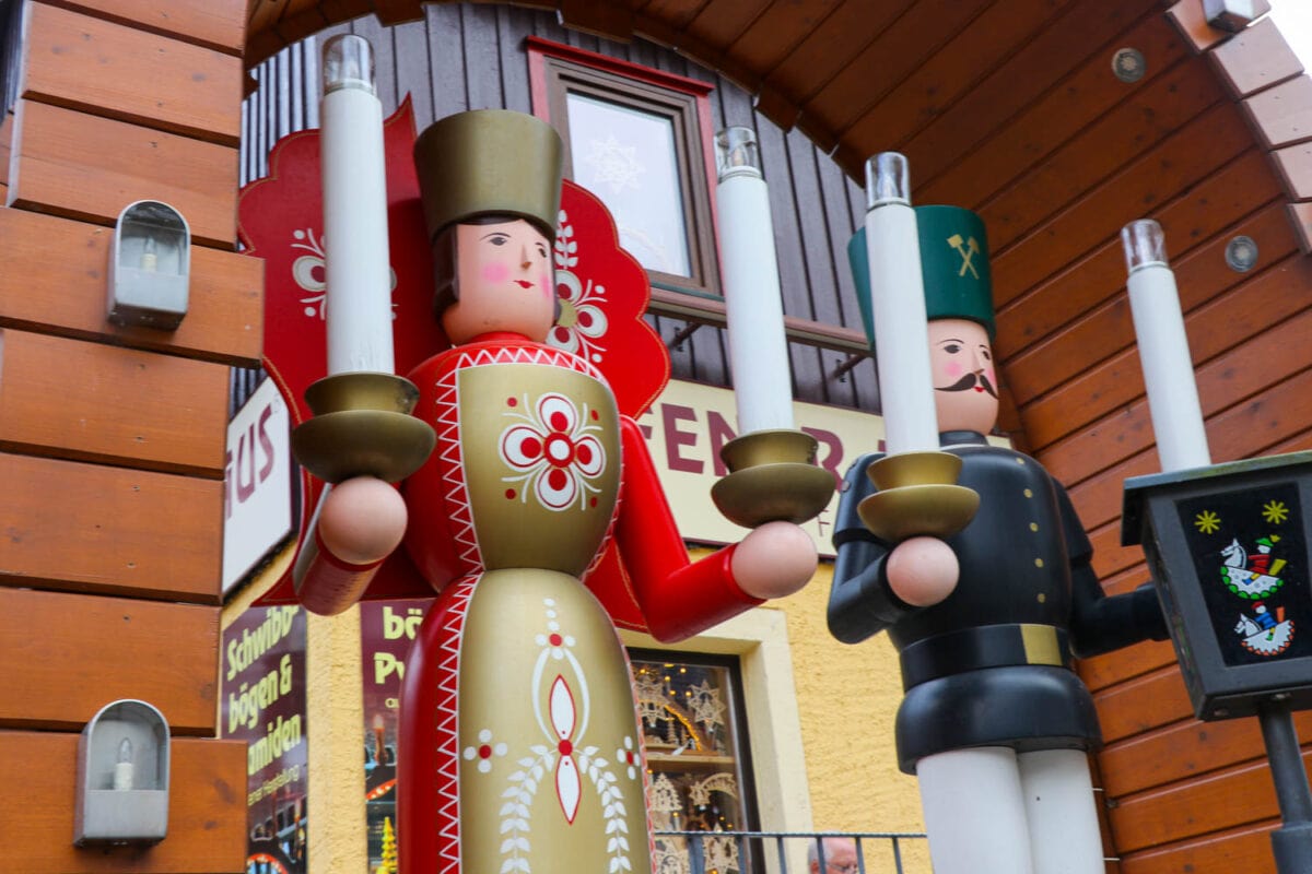 Two wooden figures on the sidewalks of Seiffen help create the feeling that it's Christmas every day 