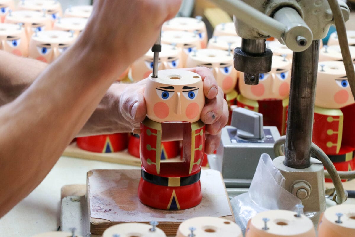 Closeup of worker carving nutcracker