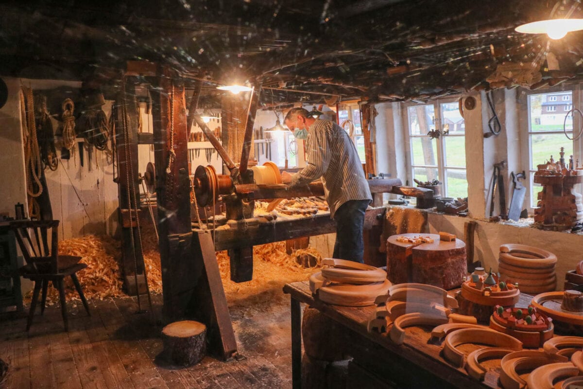 Worker demonstrates wood carving