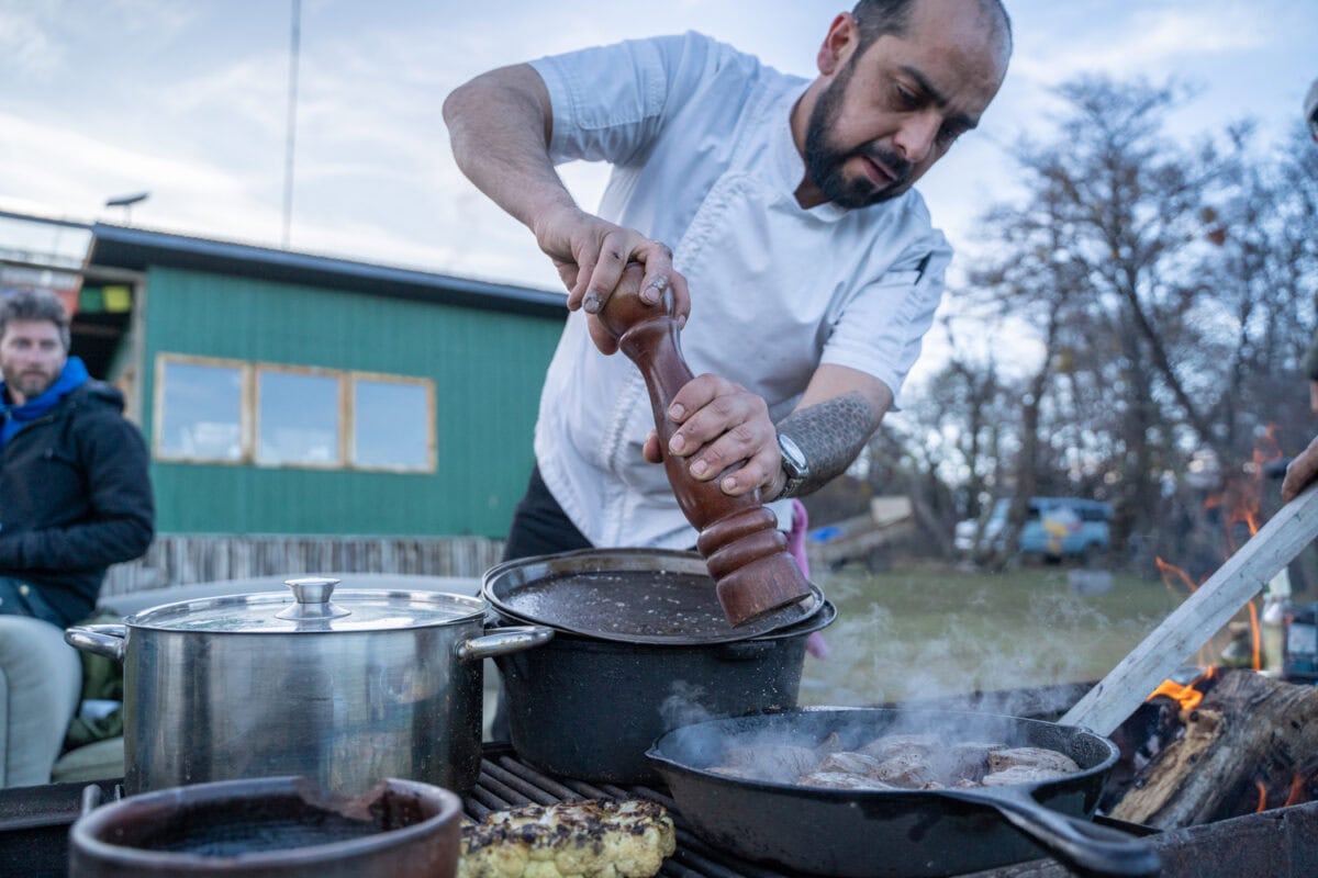 chef cooking over open flame